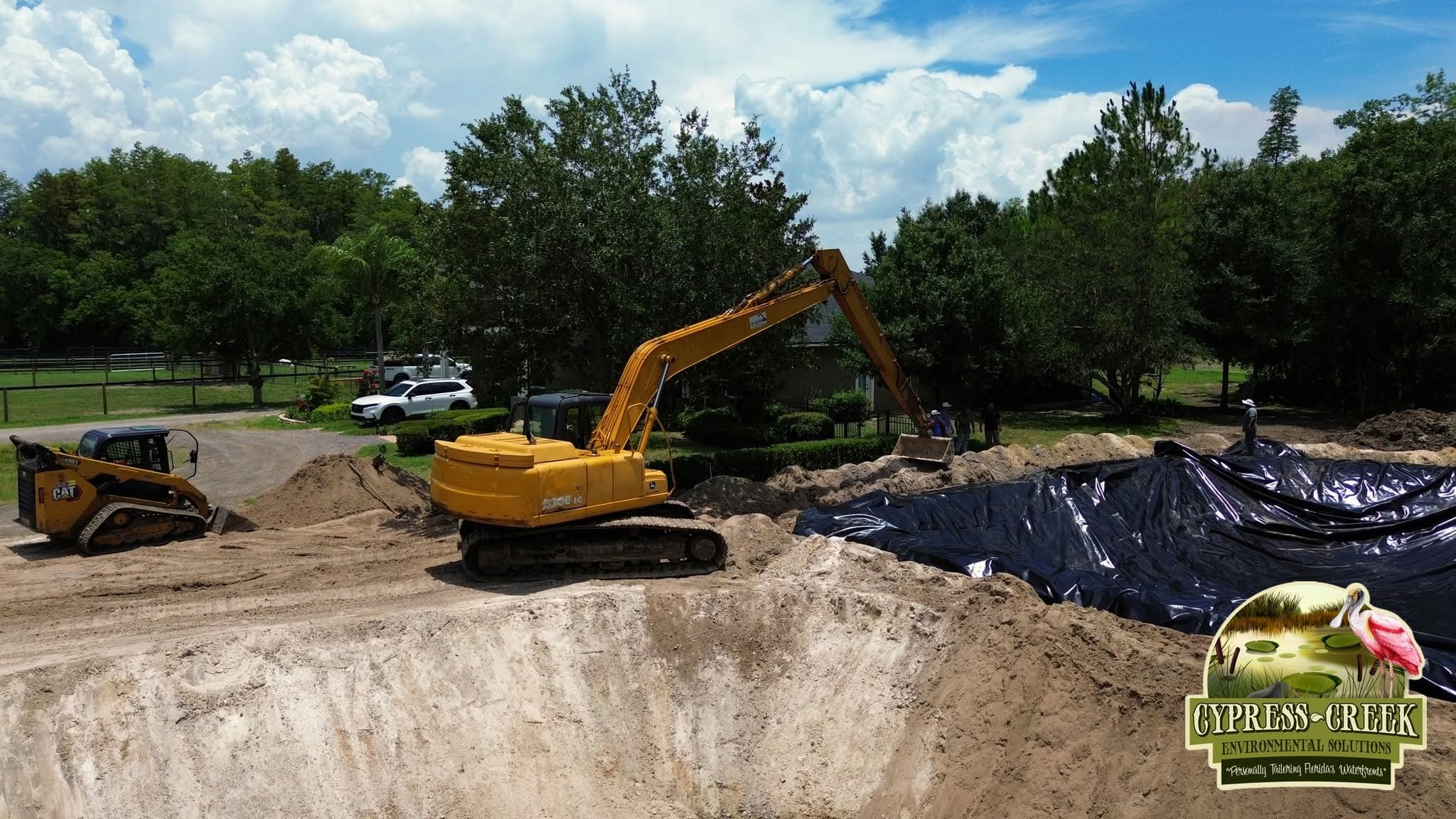 Excavator completing land enhancement work beside a Central Florida wetland