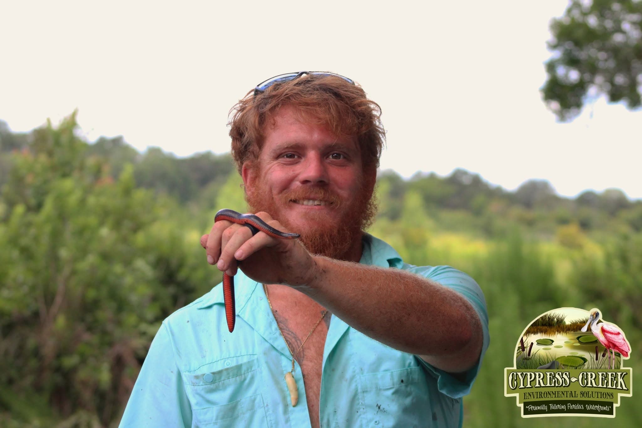 Environmental field team documenting conditions on a Florida waterway
